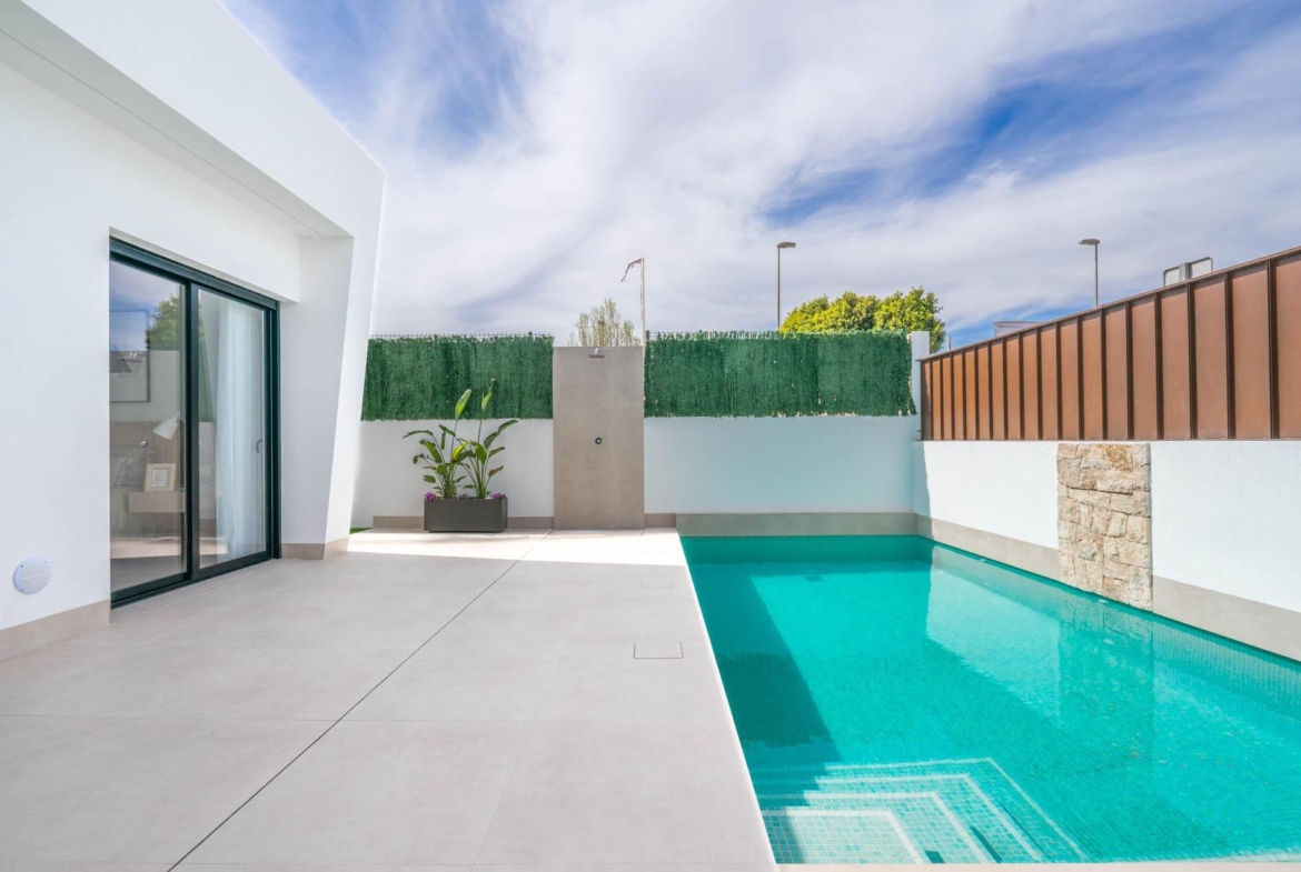 Modern Mediterranean single-storey villa in Roldán with sleek private pool and sun-drenched minimalist terrace under blue sky