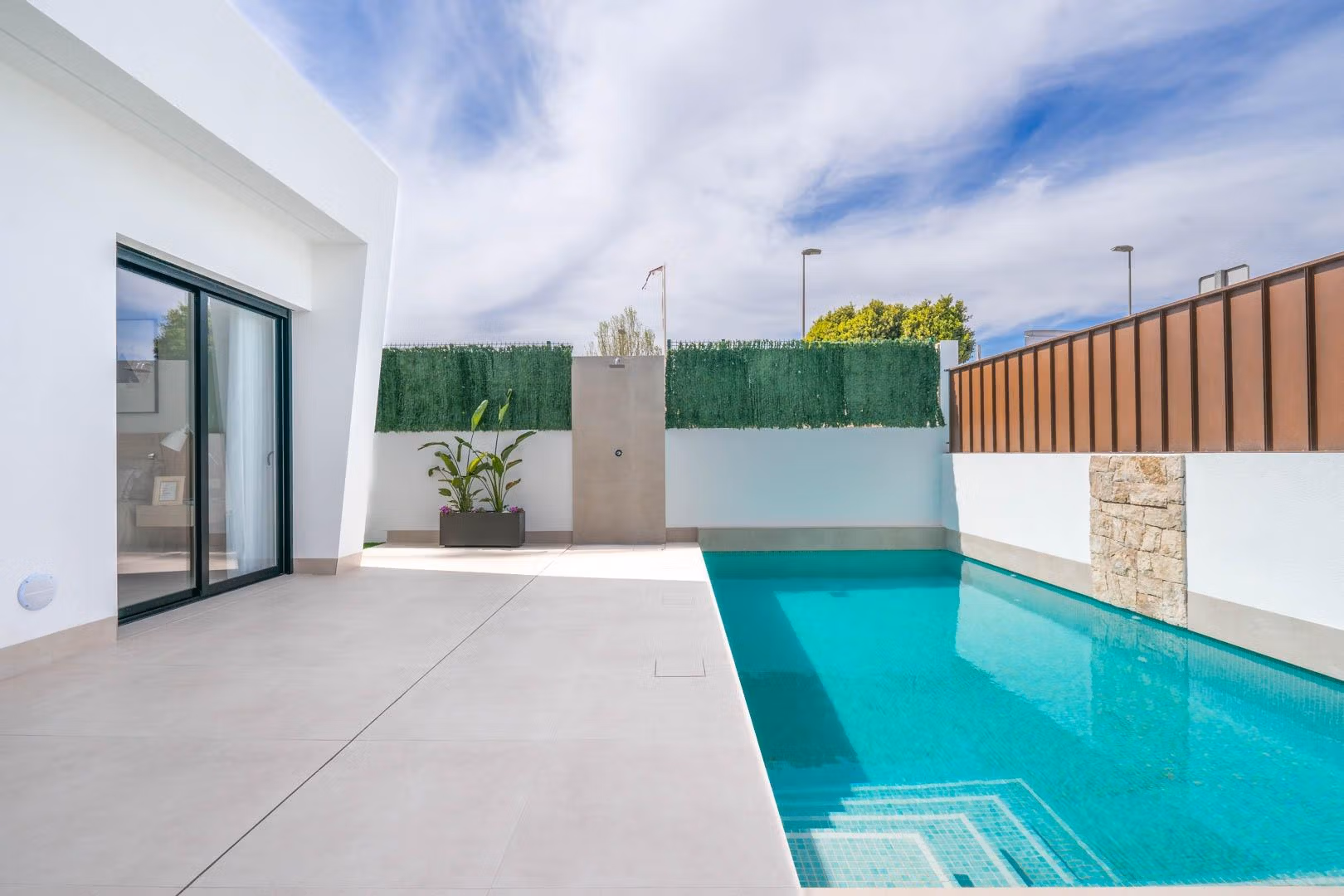 Modern Mediterranean single-storey villa in Roldán with sleek private pool and sun-drenched minimalist terrace under blue sky