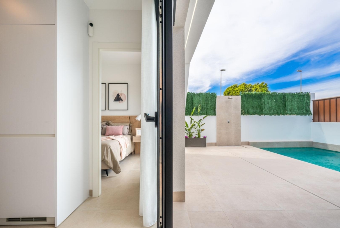 Bright modern bedroom and sleek private pool area at a Mediterranean new build single-storey villa in Roldán, Torre-Pacheco.