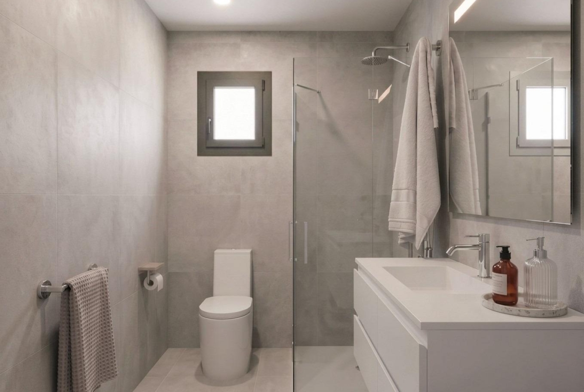 Modern, minimalist bathroom with sleek fixtures and walk-in shower in elegant new build single-storey villa in Lorca, Costa Cálida.