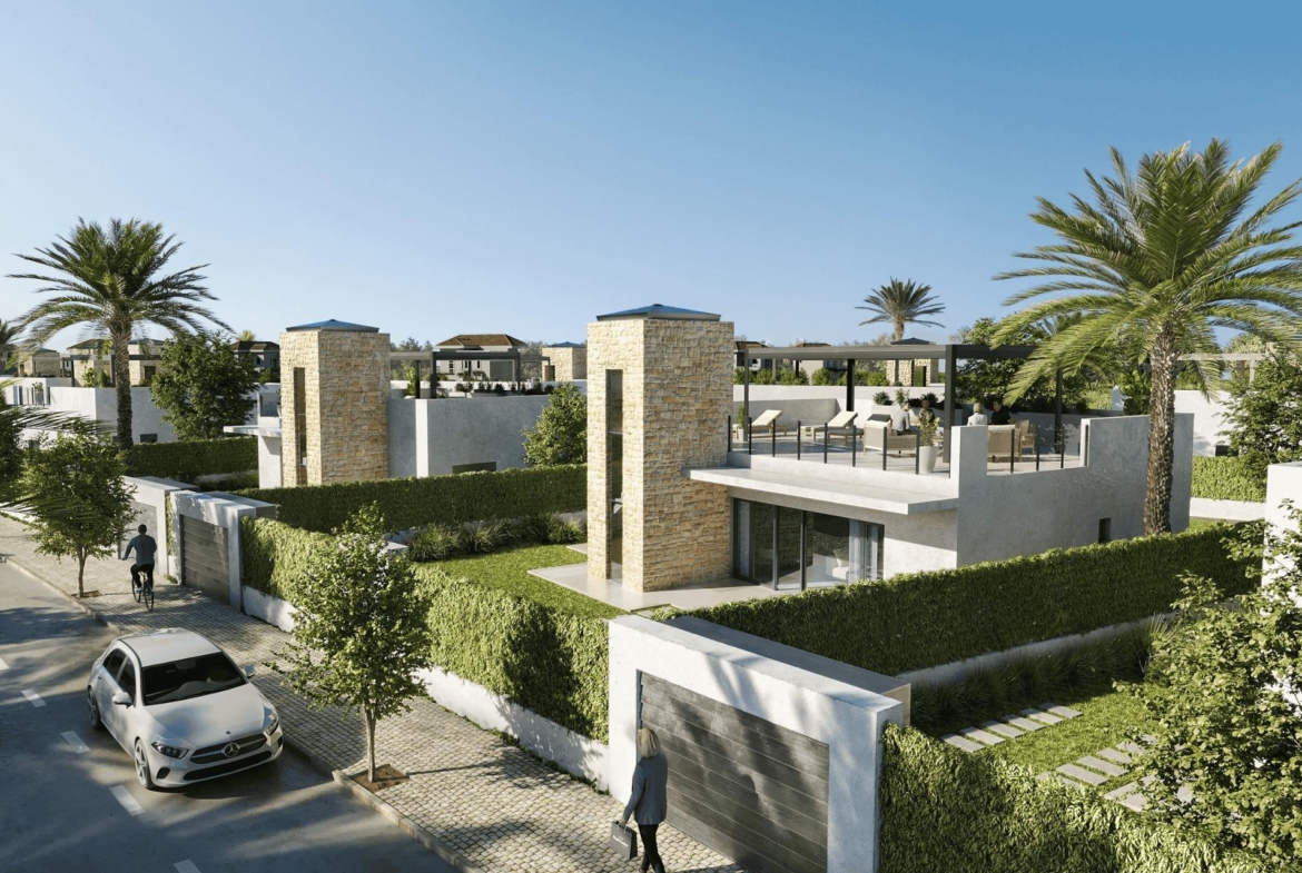 Spacious elegant single-storey villa in Lorca featuring a sun-drenched rooftop terrace surrounded by lush landscaping and palm trees.