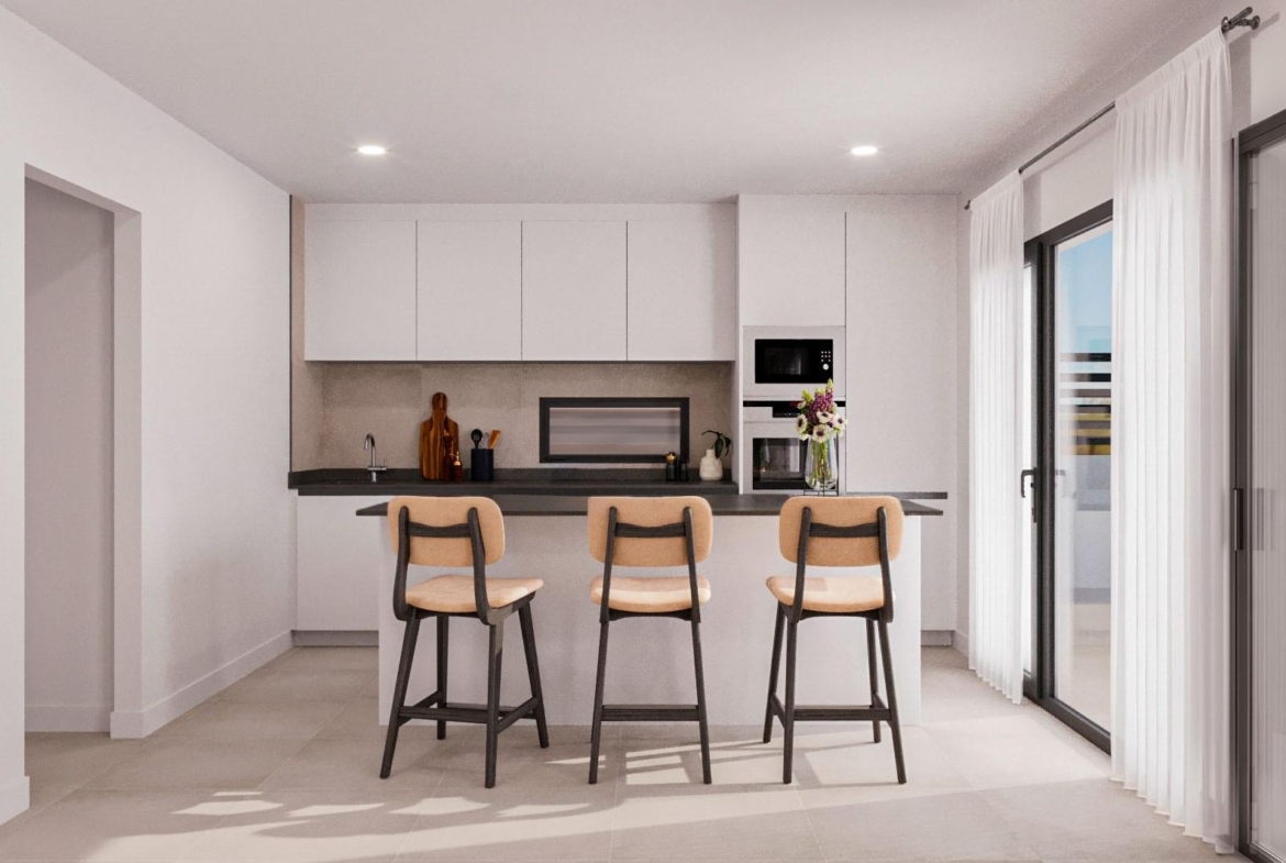 Bright modern kitchen with sleek cabinetry and breakfast bar in elegant single-storey villa, Lorca, Costa Cálida.
