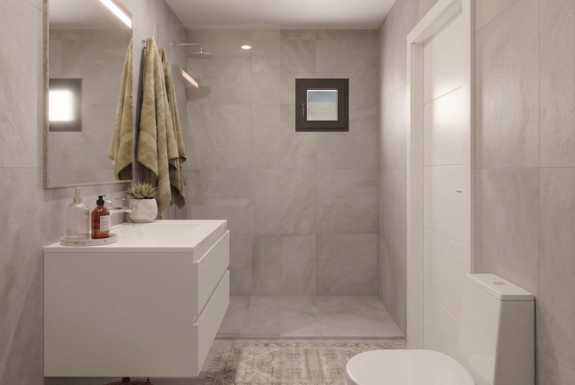 Bright, modern bathroom with sleek fixtures and walk-in shower in elegant new build single-storey villa in Lorca, Costa Cálida