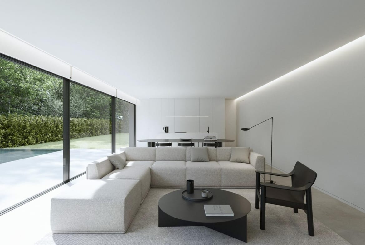 Bright, minimalist living room with sleek furniture and floor-to-ceiling windows overlooking the private pool of a new build Benidorm villa.