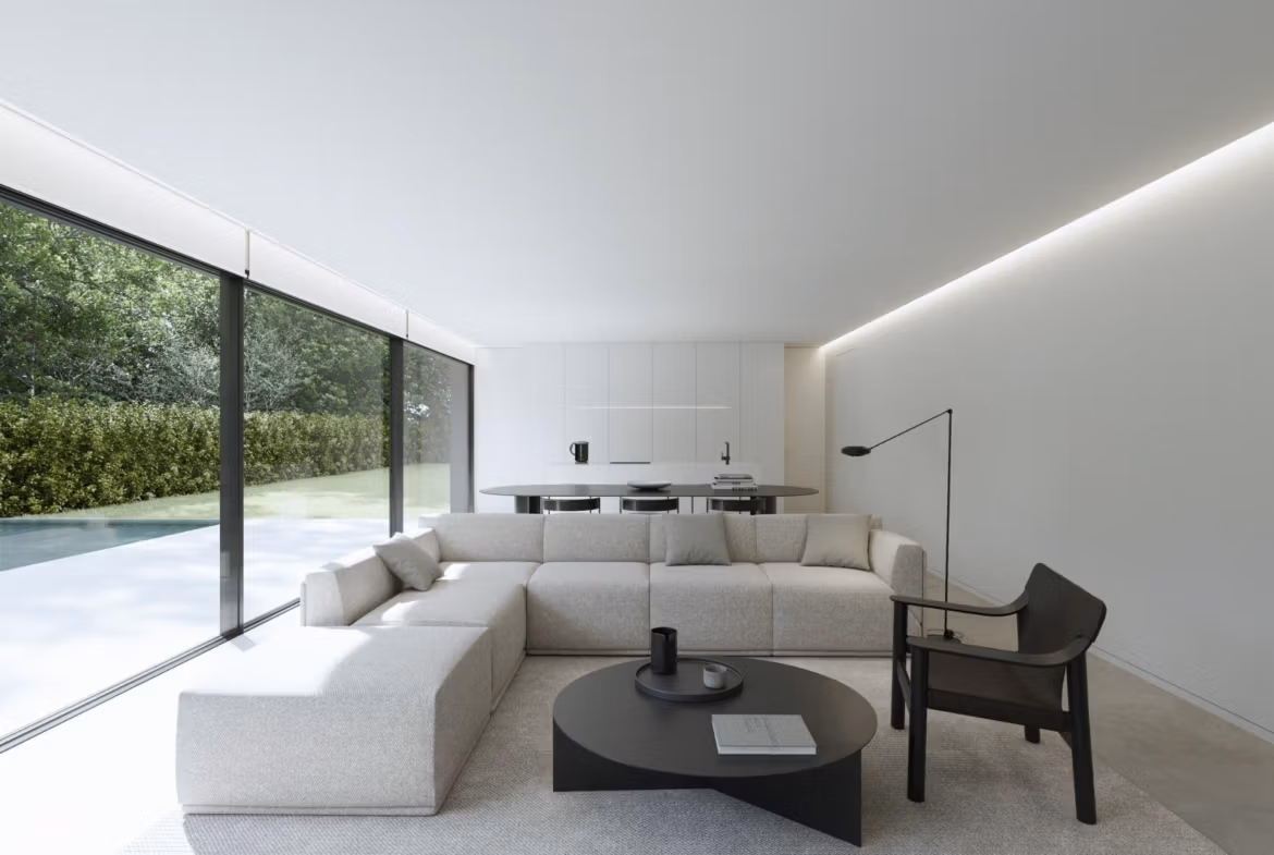 Bright, minimalist living room with sleek furniture and floor-to-ceiling windows overlooking the private pool of a new build Benidorm villa.