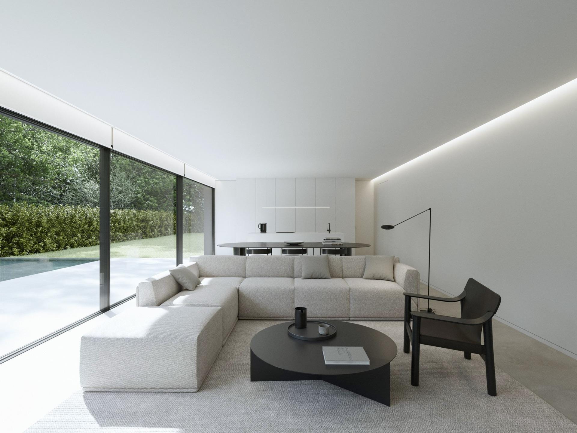 New-Build-Minimalist-Villa-in-Benidorm-with-Private-Pool-4 Bright, minimalist living room with sleek furniture and floor-to-ceiling windows overlooking the private pool of a new build Benidorm villa.