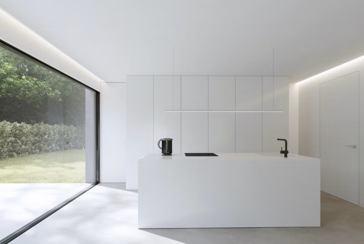 Bright minimalist kitchen with sleek white cabinetry and large floor-to-ceiling window in new Benidorm single-storey villa.