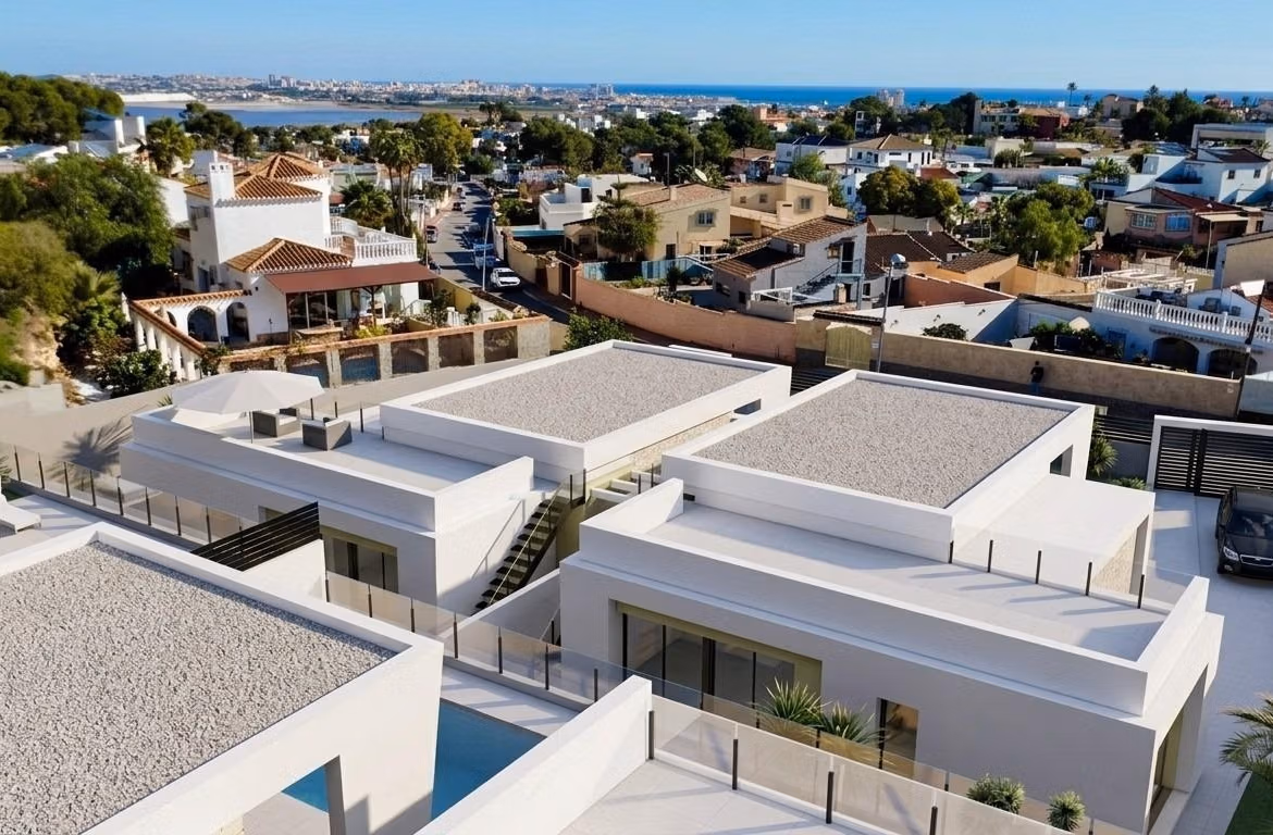 Modern single-storey villa with private pool and sun-drenched terraces in Los Balcones, Torrevieja, overlooking the sea and town.