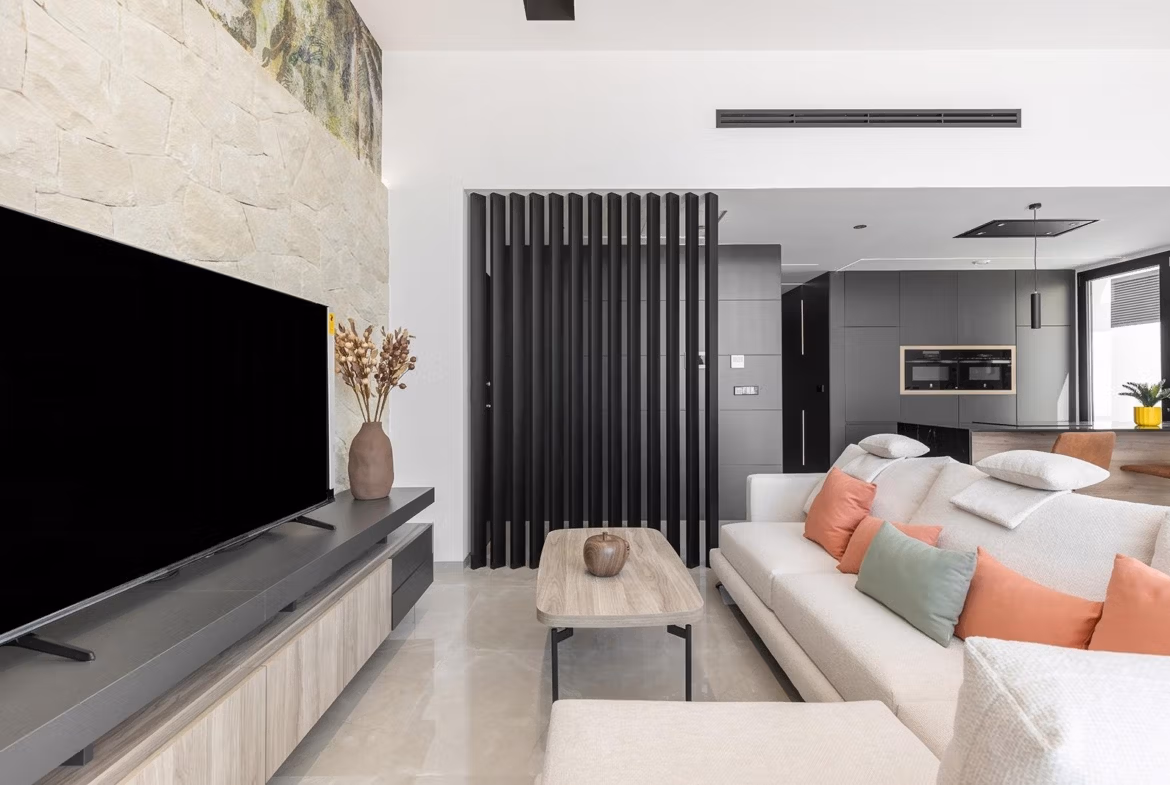 Modern, bright open-plan living area with sleek kitchen in a luxury single-storey villa in Los Balcones, Torrevieja