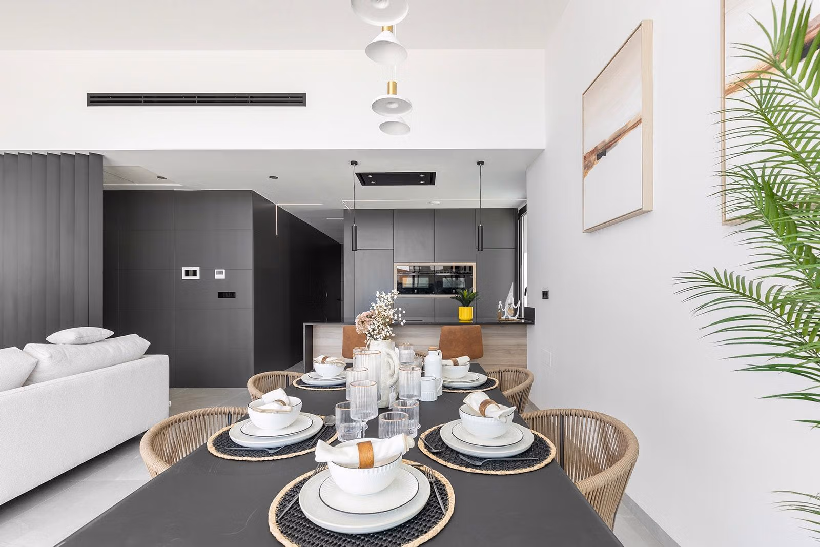 New-Build-One-Story-Villas-with-Private-Pool-in-Torrevieja-27 Bright open-plan dining and living area with modern kitchen in a luxury new build single-storey villa in Los Balcones, Torrevieja