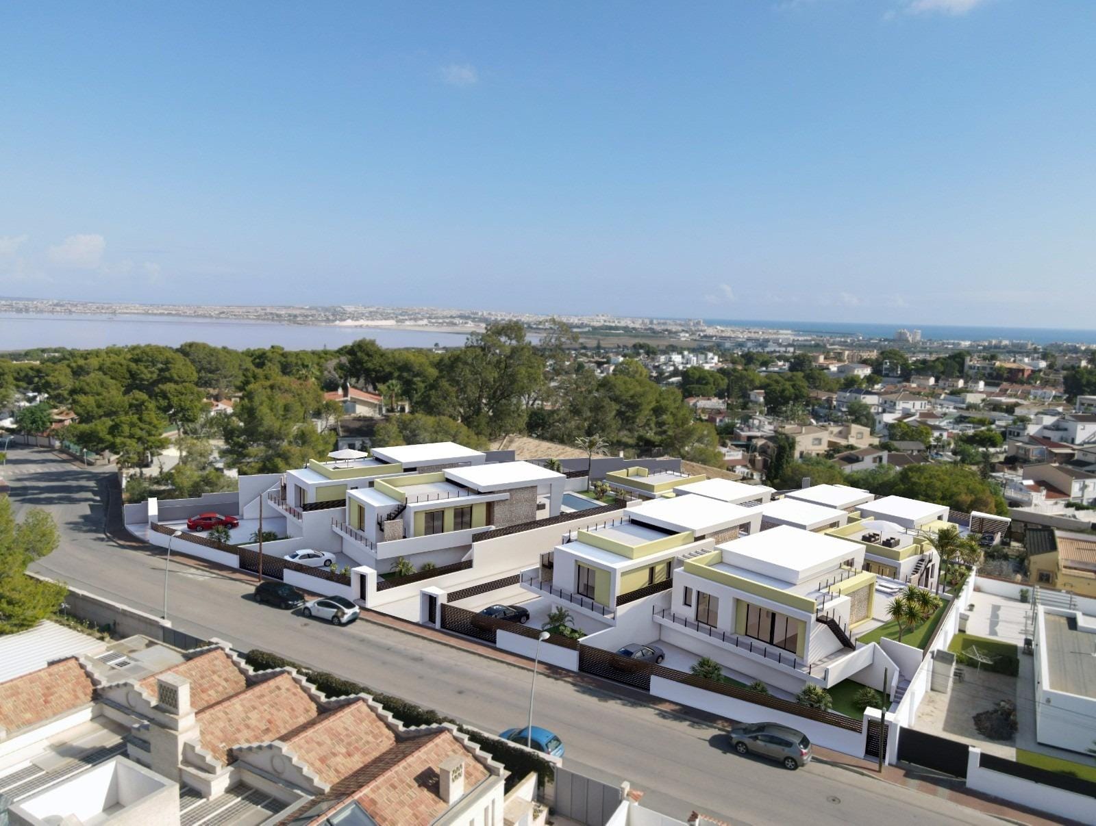New-Build-One-Story-Villas-with-Private-Pool-in-Torrevieja-8 Modern single-storey villas with private pools and sleek terraces in sunlit Los Balcones, Torrevieja, overlooking lush surroundings.