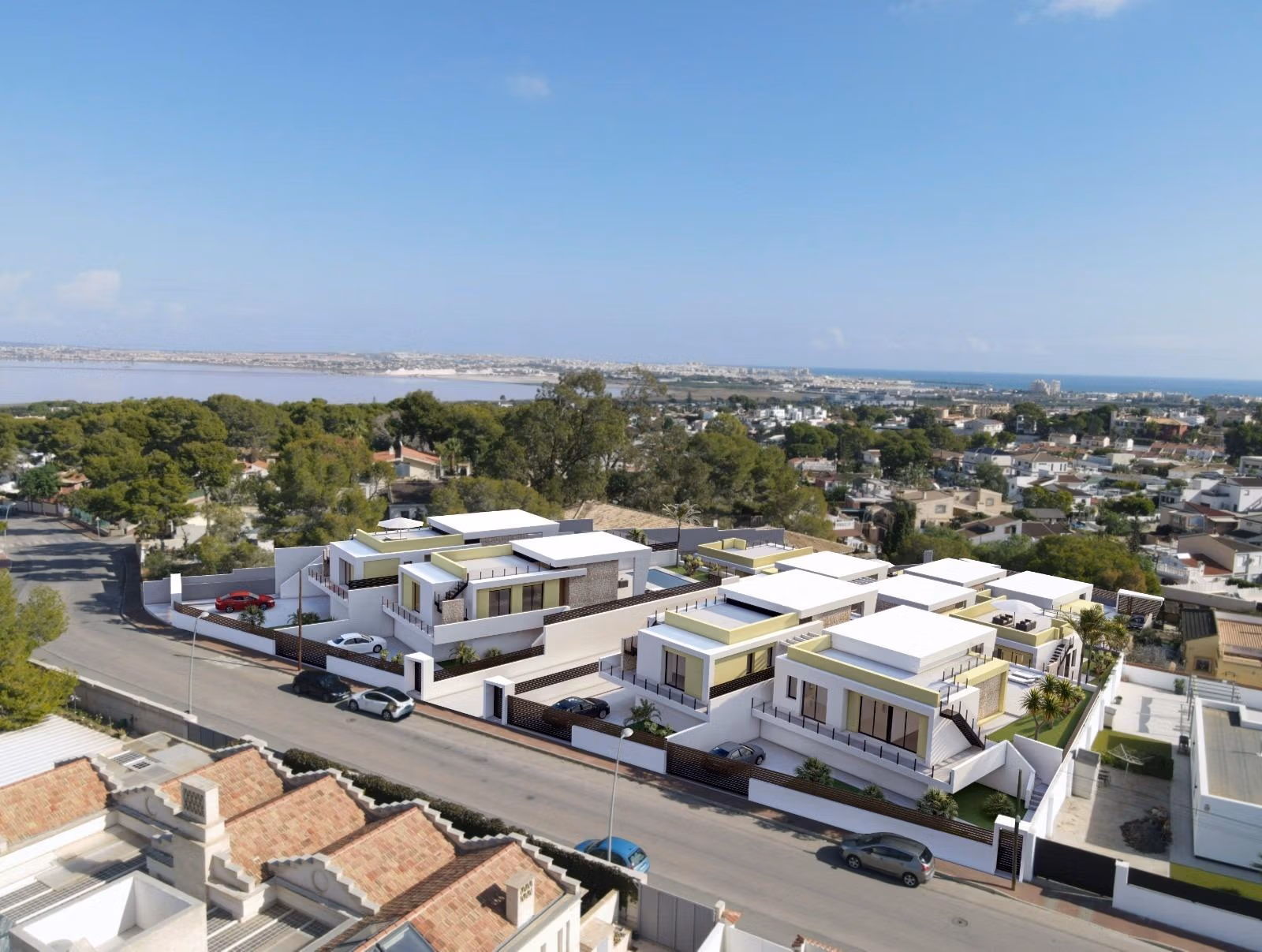 New-Build-One-Story-Villas-with-Private-Pool-in-Torrevieja-8 Modern single-storey villas with private pools and sleek terraces in sunlit Los Balcones, Torrevieja, overlooking lush surroundings.