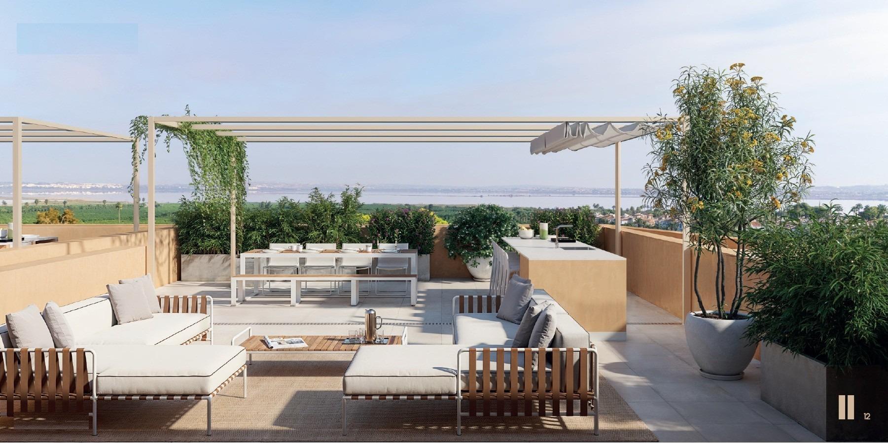 Spacious sun-drenched terrace with elegant outdoor seating and panoramic views in new build residential apartments in Los Balcones, Torrevieja.