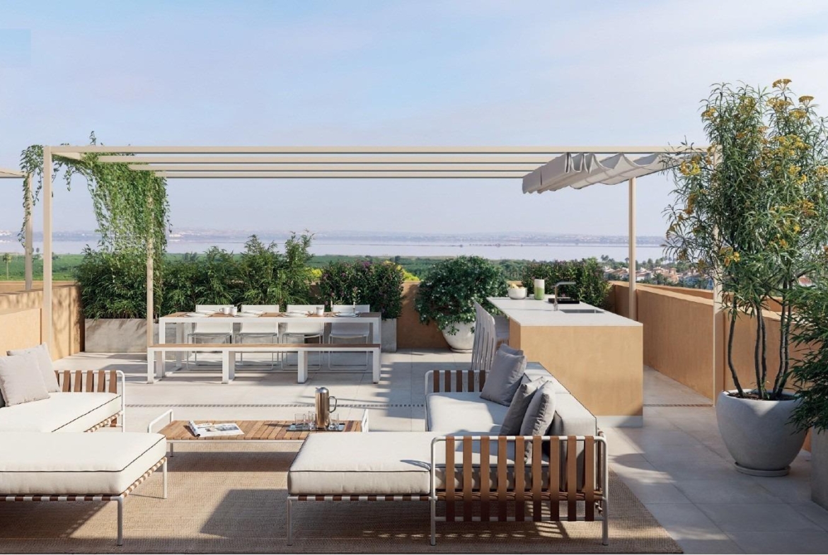 Spacious sun-drenched terrace with elegant outdoor seating and lush greenery in new build residential apartments, Los Balcones, Torrevieja