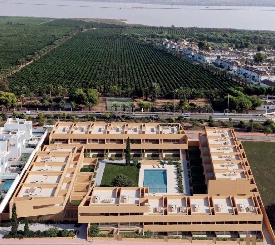 Modern new build residential apartments with a spacious pool and landscaped courtyard in sunlit Los Balcones, Torrevieja.