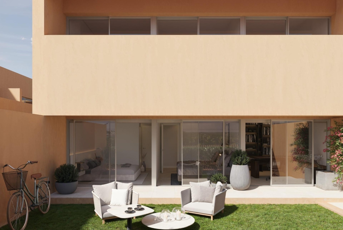Modern sunlit terrace with elegant outdoor seating and lush garden at new build residential apartments in Los Balcones, Torrevieja