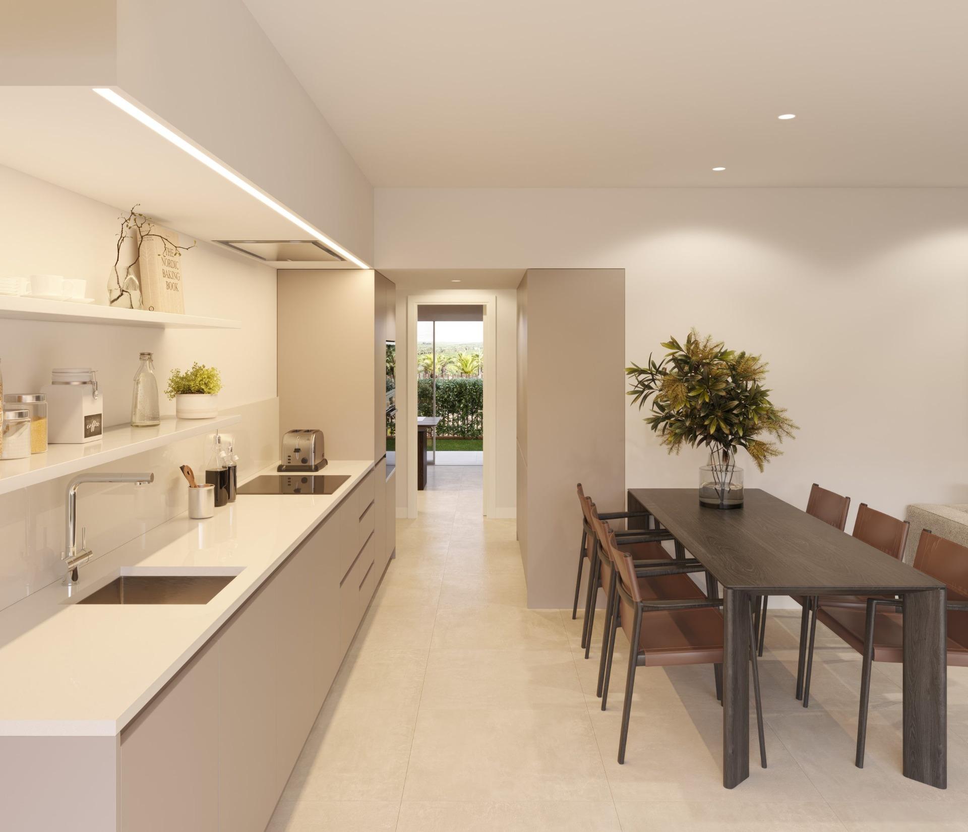 Bright modern kitchen and elegant dining area in new build residential apartments in Los Balcones, Torrevieja