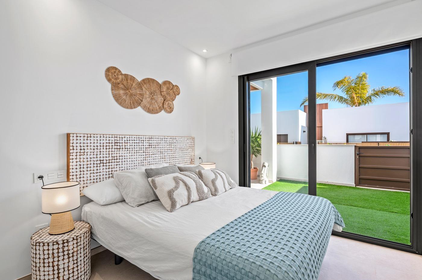 Bright modern ground floor bedroom with garden view in luxury 2-bedroom apartment at Serena Golf, Los Alcazares.