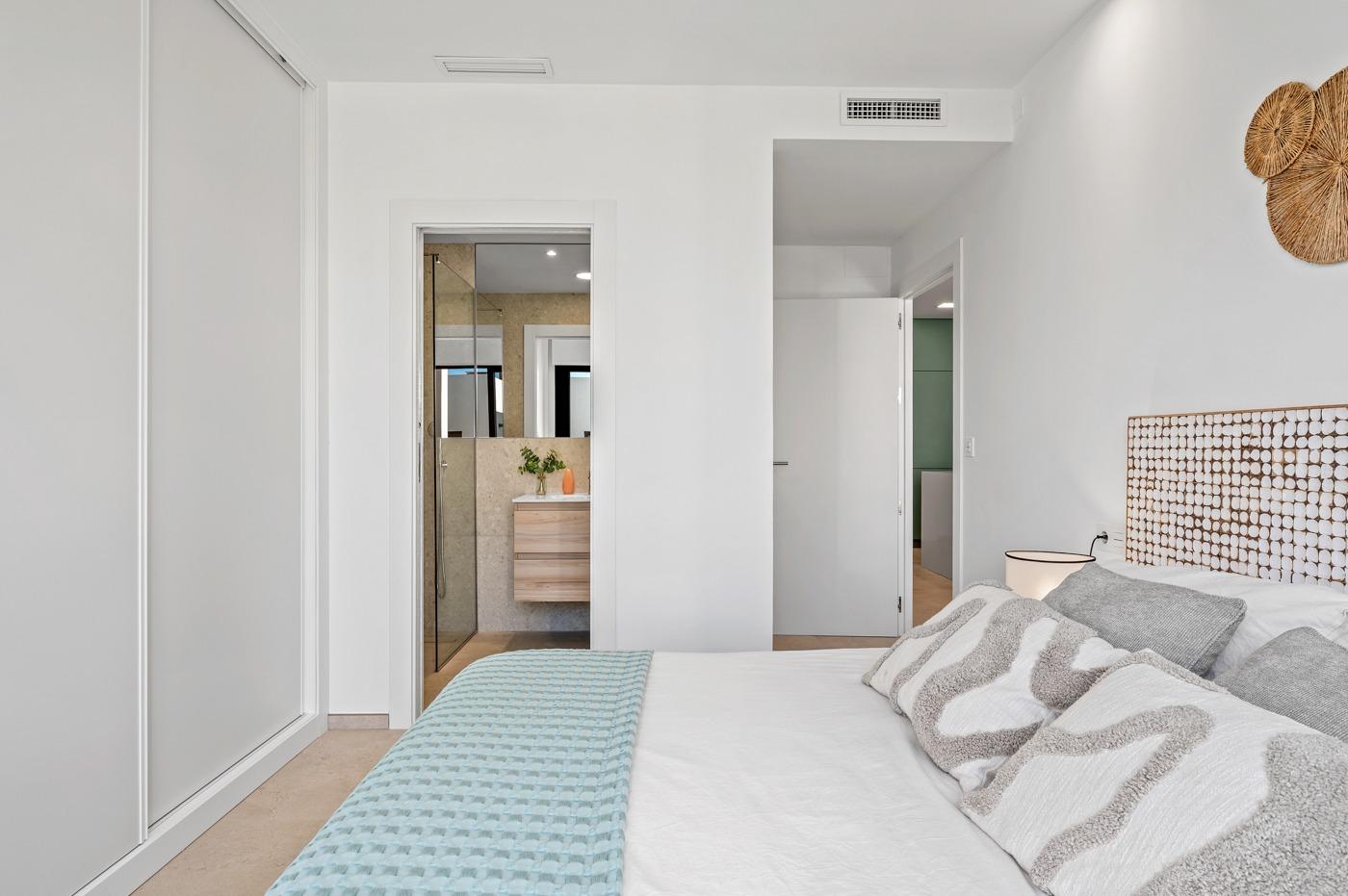 Bright modern 2-bedroom ground floor apartment bedroom with elegant decor in Serena Golf, Los Alcazares.