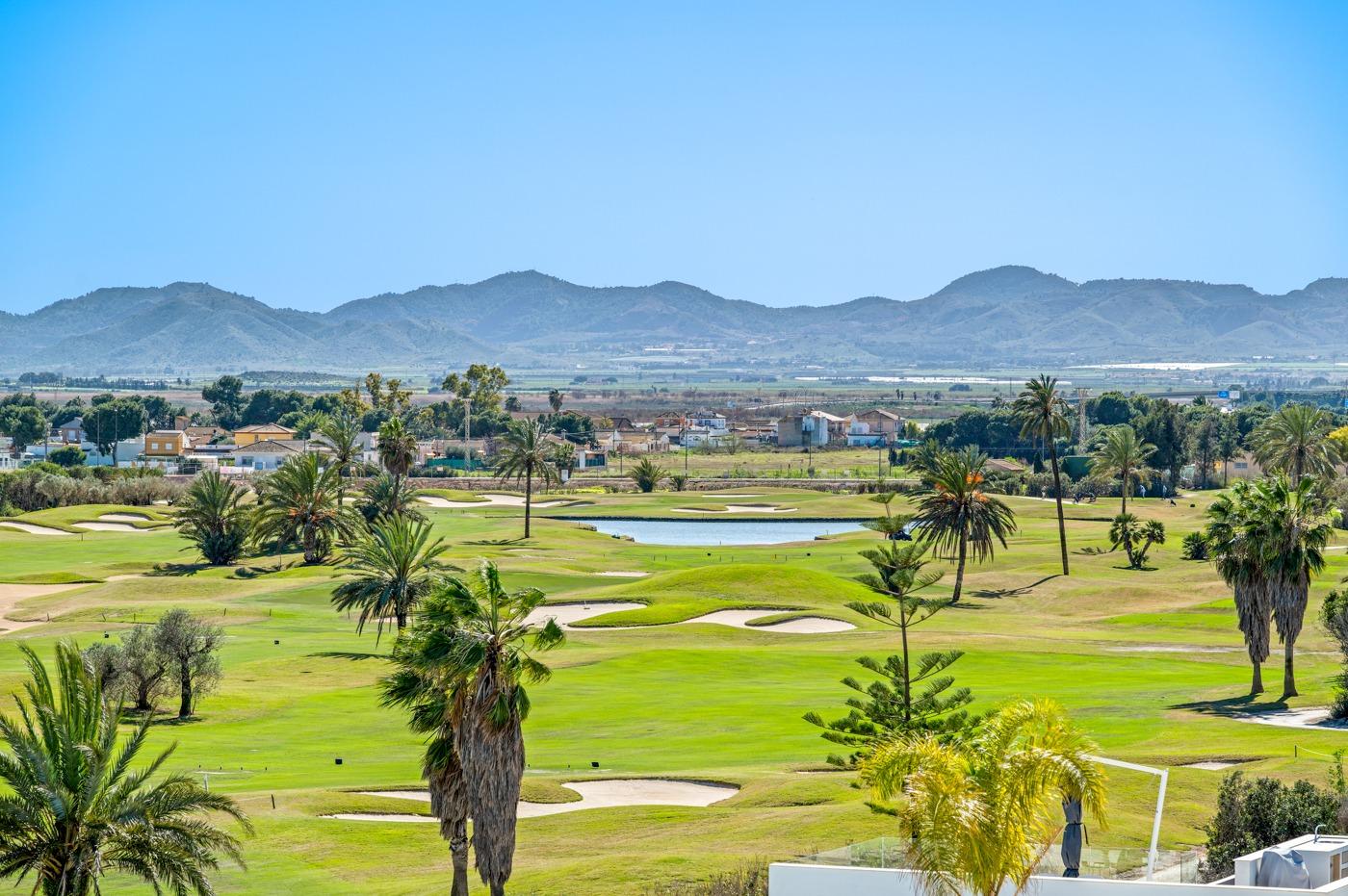 Panoramic sunlit golf course and mountain views from the bright first floor 2 bedroom apartment in Serena Golf, Los Alcazares.