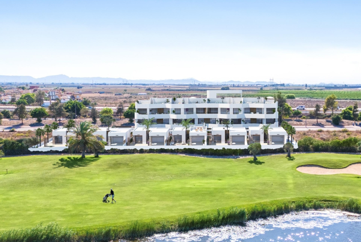 Modern bright first-floor 2-bedroom apartment overlooking lush Serena Golf course and shimmering water in Los Alcazares.
