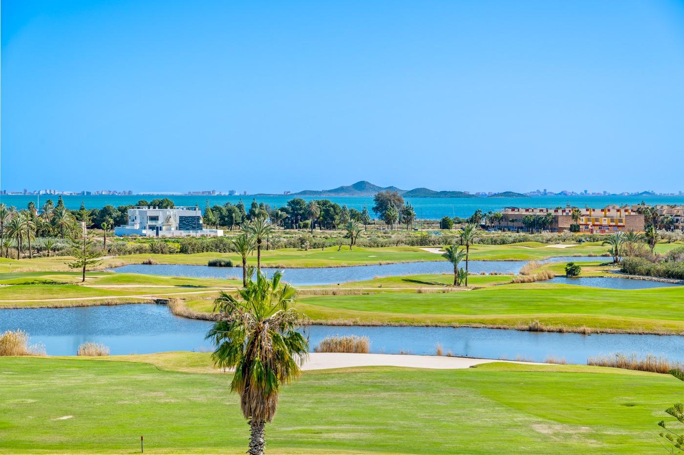 Panoramic sun-drenched golf course and serene water views from a modern 2-bedroom ground floor apartment in Serena Golf, Los Alcazares.