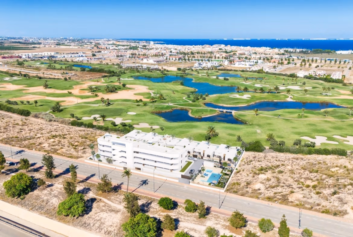 Modern two-bedroom ground floor apartment with private garden, pools, and panoramic golf course views in Serena Golf, Los Alcazares.