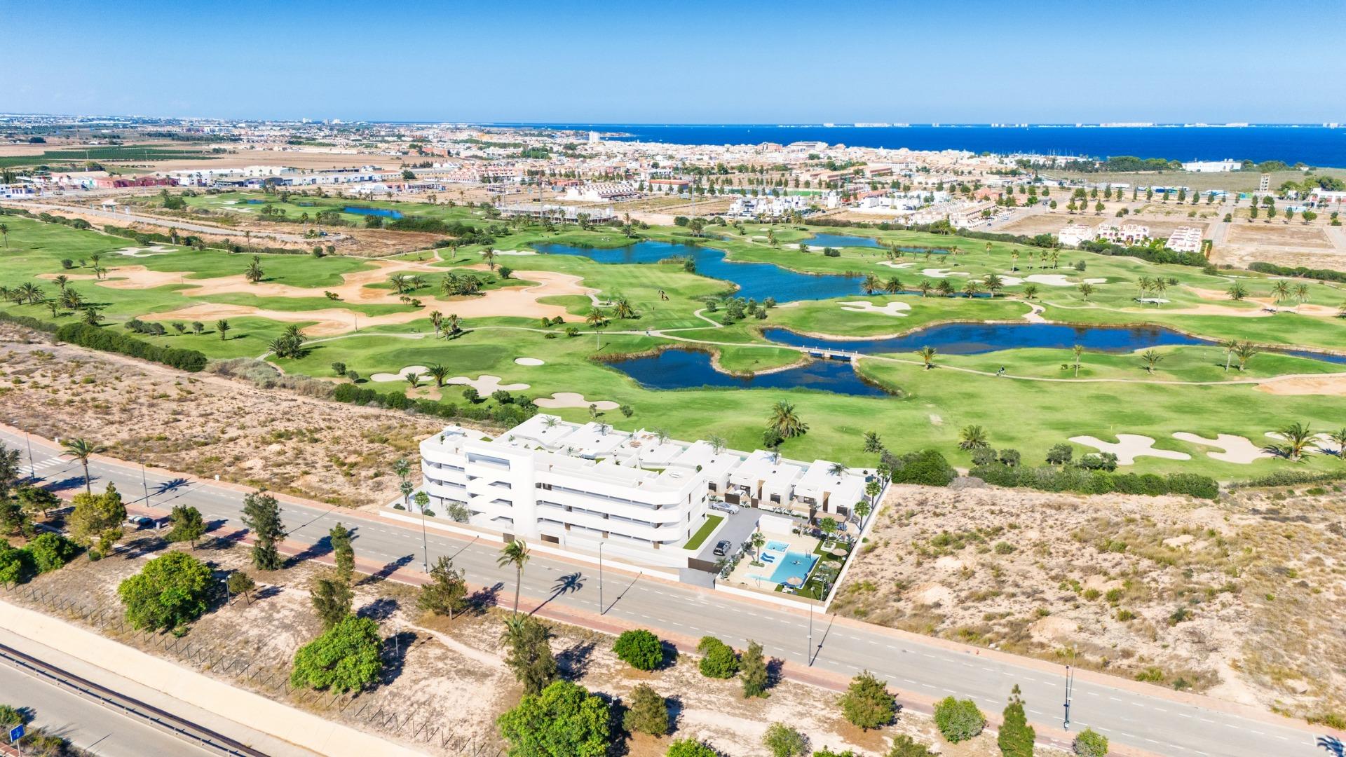 Modern two-bedroom ground floor apartment with private garden, pools, and panoramic golf course views in Serena Golf, Los Alcazares.