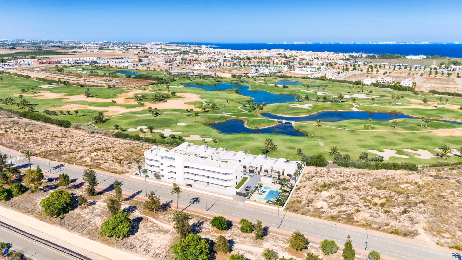 Modern two-bedroom ground floor apartment with private garden, pools, and panoramic golf course views in Serena Golf, Los Alcazares.