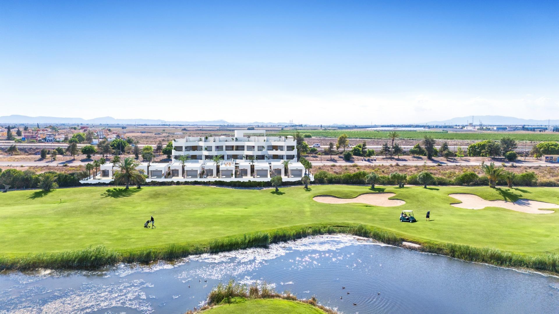 Modern two-bedroom ground floor apartment with garden overlooking lush, sunlit Serena Golf course in Los Alcazares.