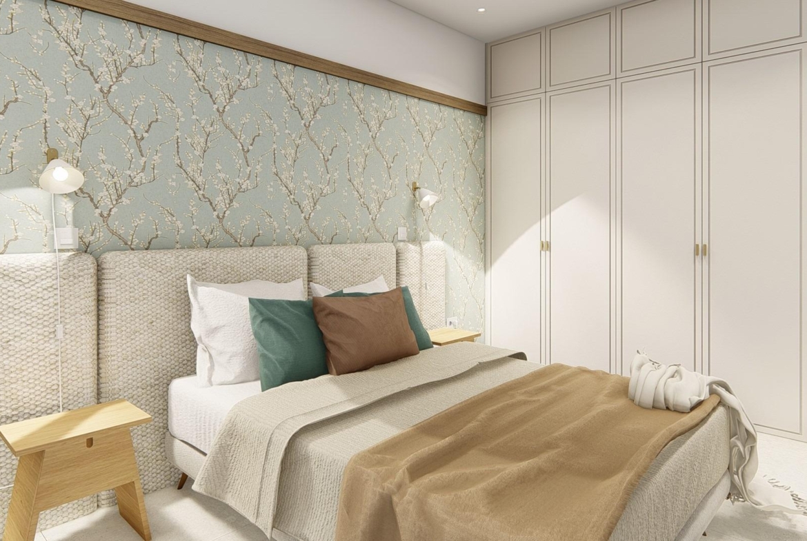 Elegant, spacious bedroom with soft textured headboard, floral accent wall, and built-in wardrobes in Dolores semi-detached villa.