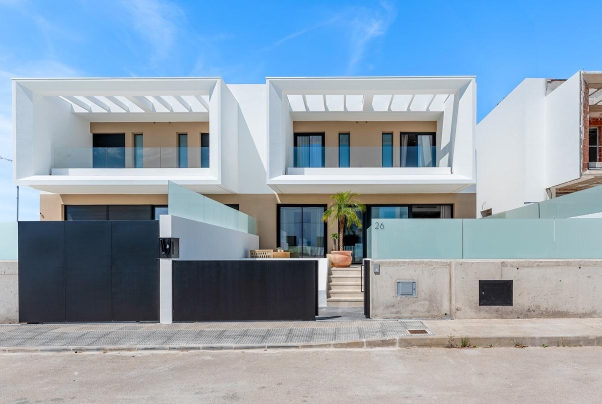 Modern spacious 3-bedroom semi-detached villa with sleek balconies and private entrance in sunny Dolores, Alicante.