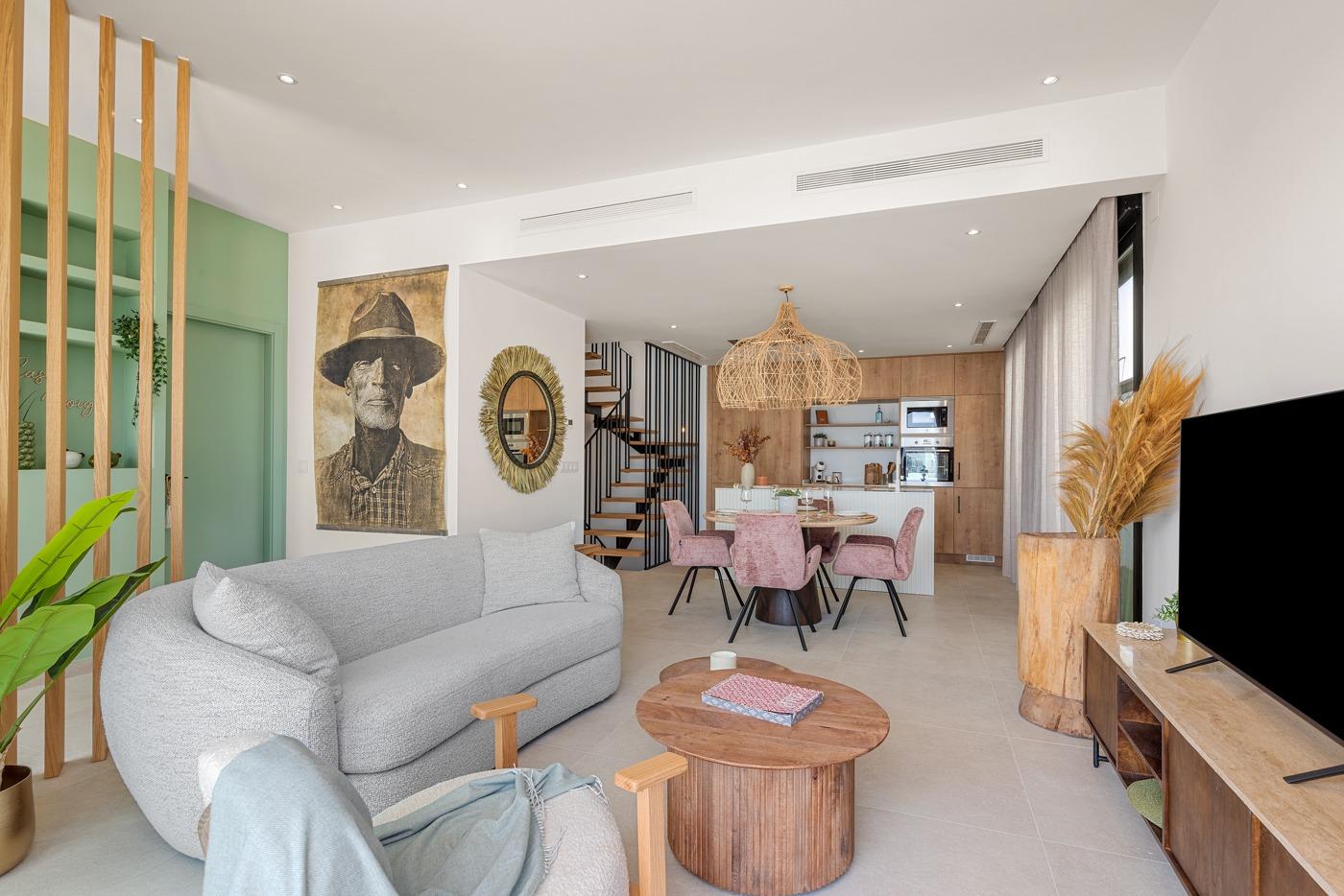Bright open-plan living and dining area with modern kitchen in spacious new build 3-bedroom villa in Dolores, Alicante.