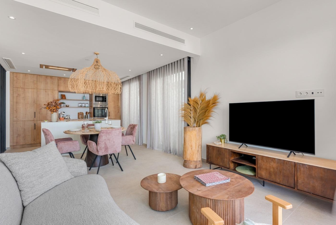 Bright, modern open-plan living and dining area with stylish furnishings in a spacious 3-bedroom villa in Dolores, Alicante.