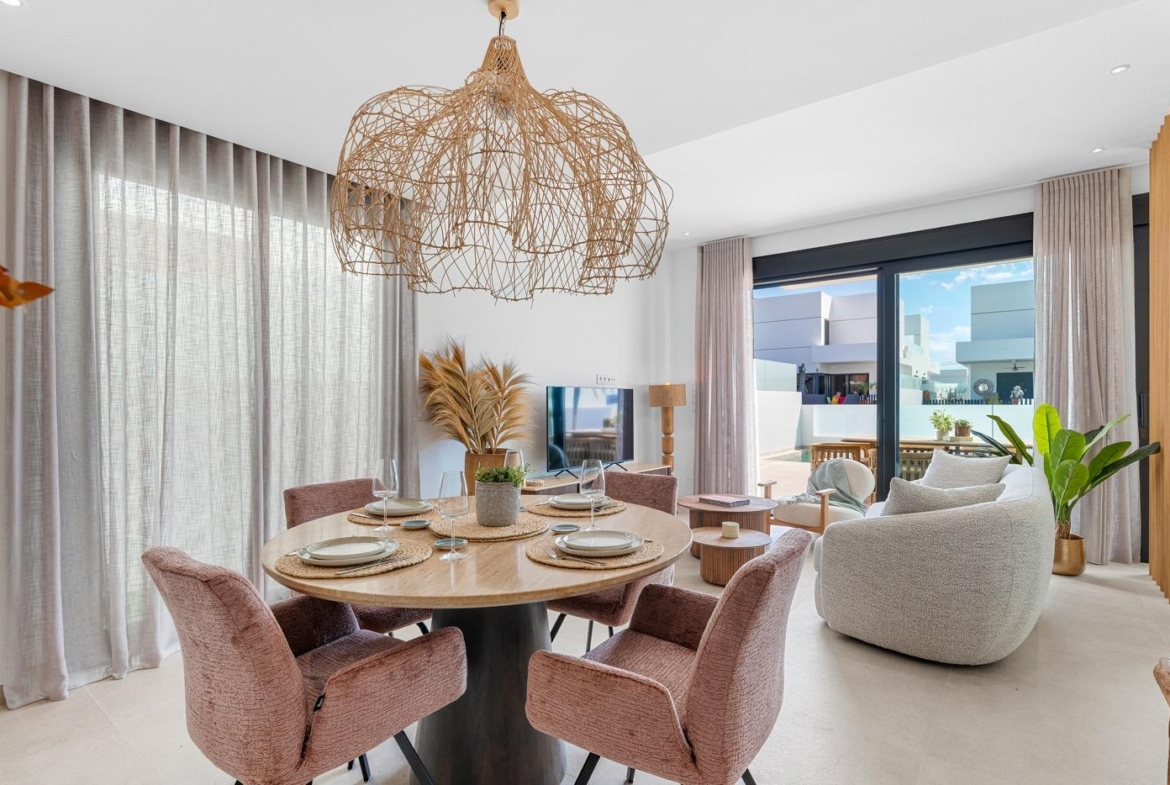 Bright open-plan dining and living area with elegant furnishings in a spacious 3-bedroom semi-detached villa in Dolores, Alicante