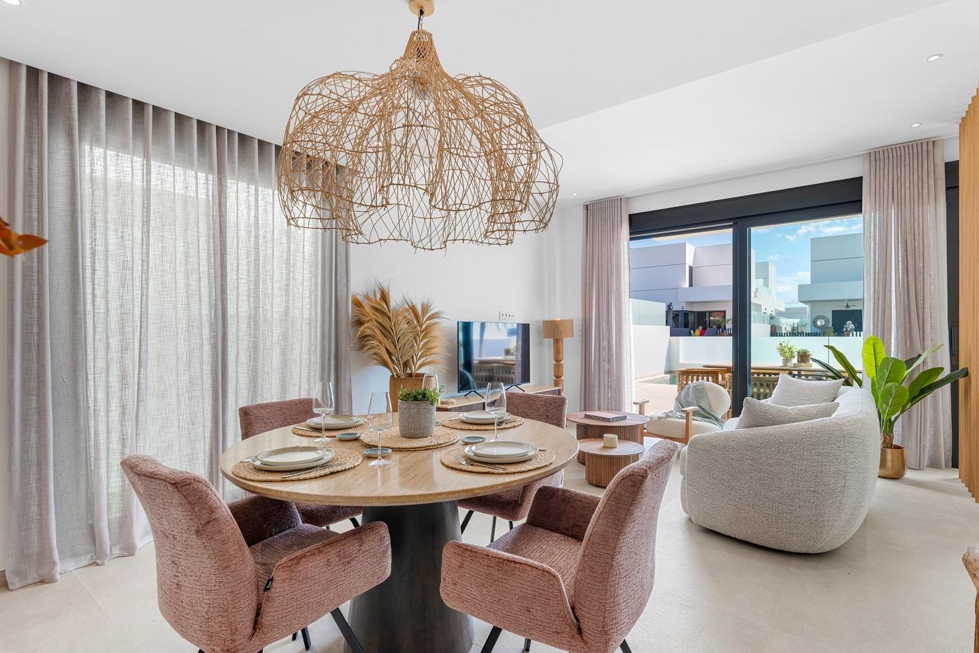 Bright open-plan dining and living area with elegant furnishings in a spacious 3-bedroom semi-detached villa in Dolores, Alicante