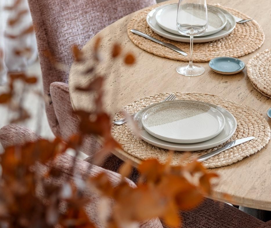 Elegant, sunlit dining table set with textured plates and glasses in a spacious semi-detached 3-bedroom villa in Dolores, Alicante.