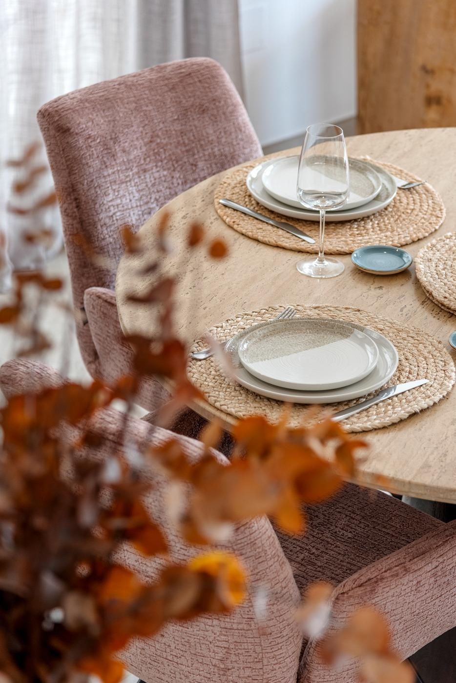Elegant, sunlit dining table set with textured plates and glasses in a spacious semi-detached 3-bedroom villa in Dolores, Alicante.