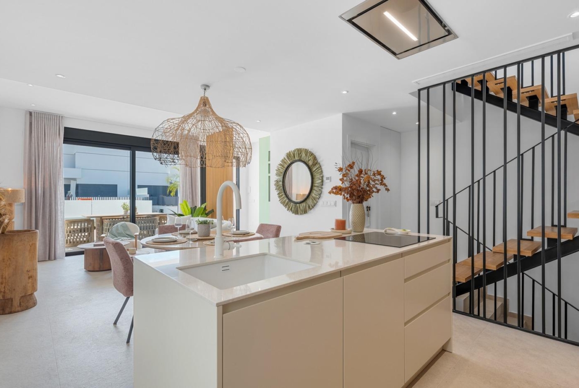 Bright modern kitchen with stylish island and natural accents in spacious 3-bedroom semi-detached villa, Dolores Alicante.