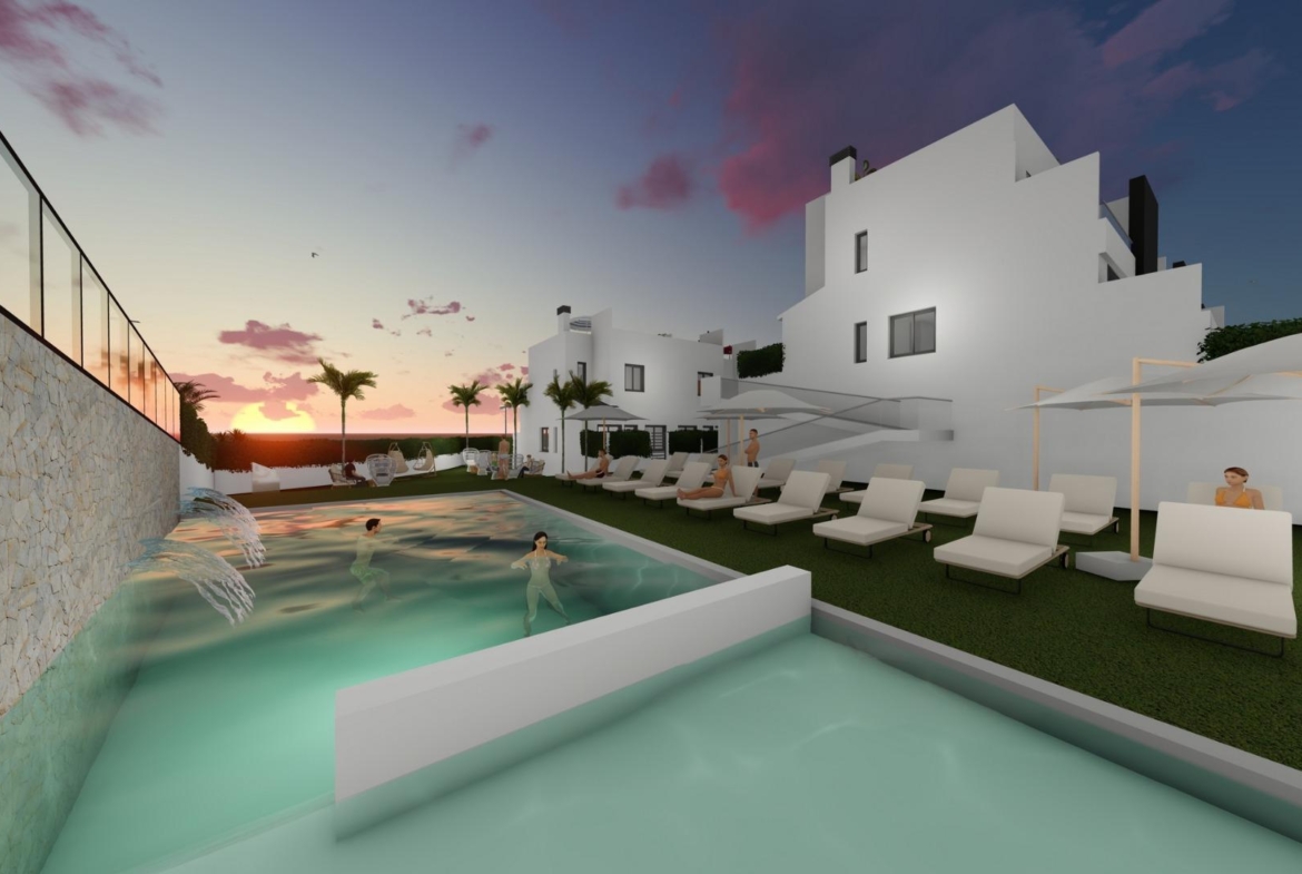 Sunset view of a modern communal pool with cascading water and lounge chairs at spacious 3-bedroom townhouse in Cox, Alicante.