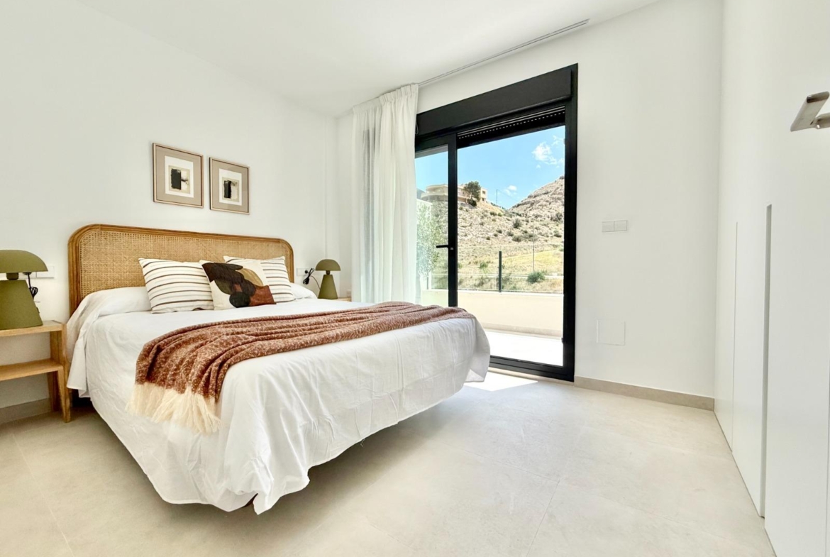 Bright and airy bedroom in spacious new build 3-bedroom townhouse with terrace and serene mountain views in Cox, Alicante.