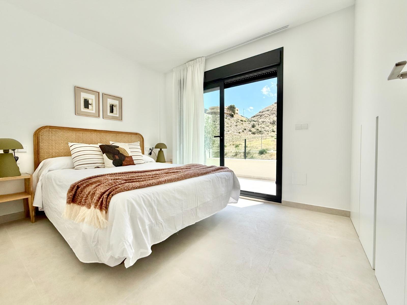 Bright, modern bedroom with natural light and mountain views in an affordable new build 2-bedroom townhouse in Cox, Alicante.