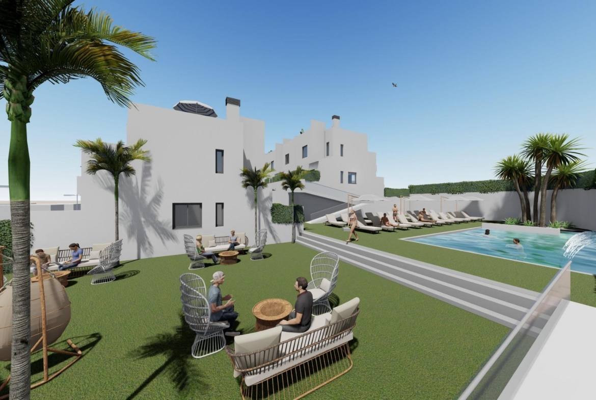 Modern spacious 3-bedroom townhouse in Cox Alicante with sun-drenched solarium, lush garden, and inviting communal pool area.