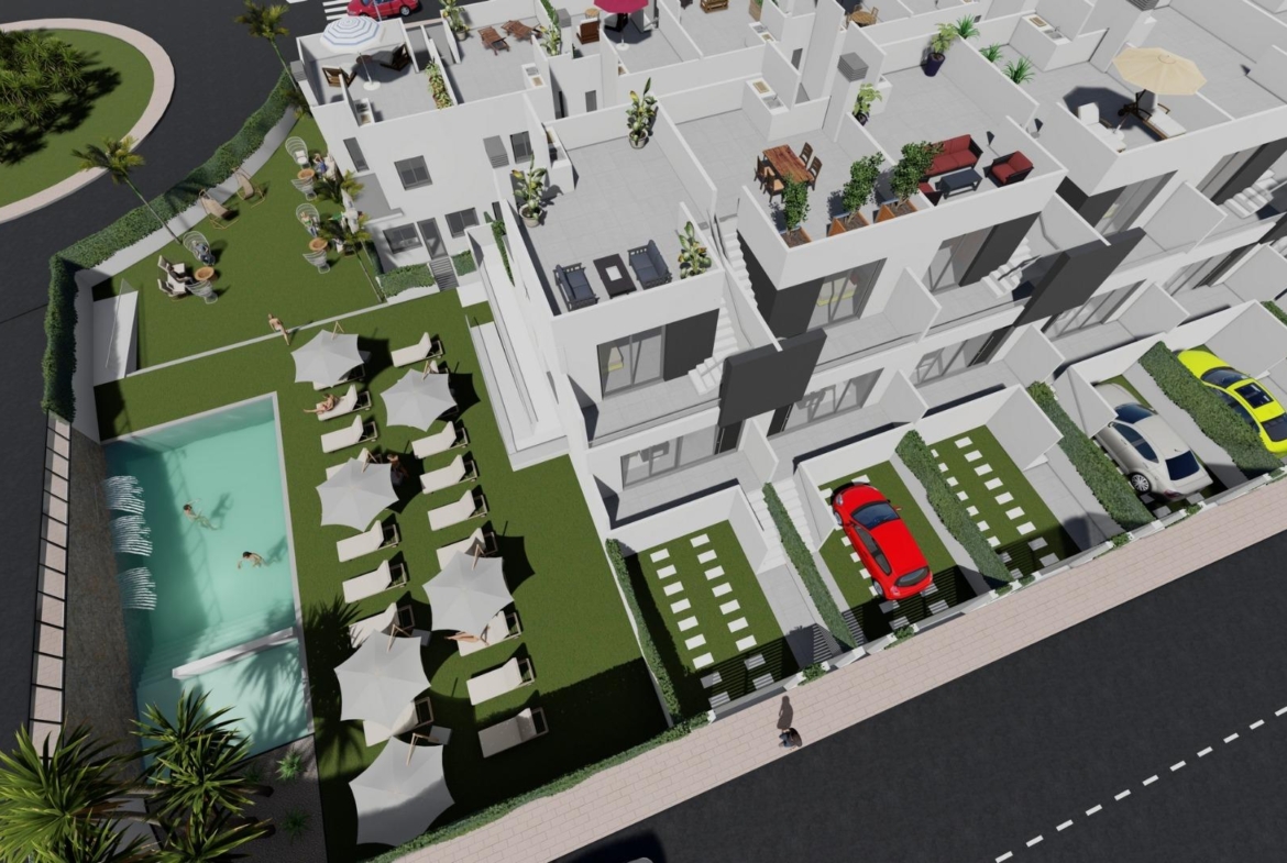 Modern affordable 2-bedroom townhouse in Cox, Alicante featuring a sunlit solarium, private parking, and a landscaped communal pool area.