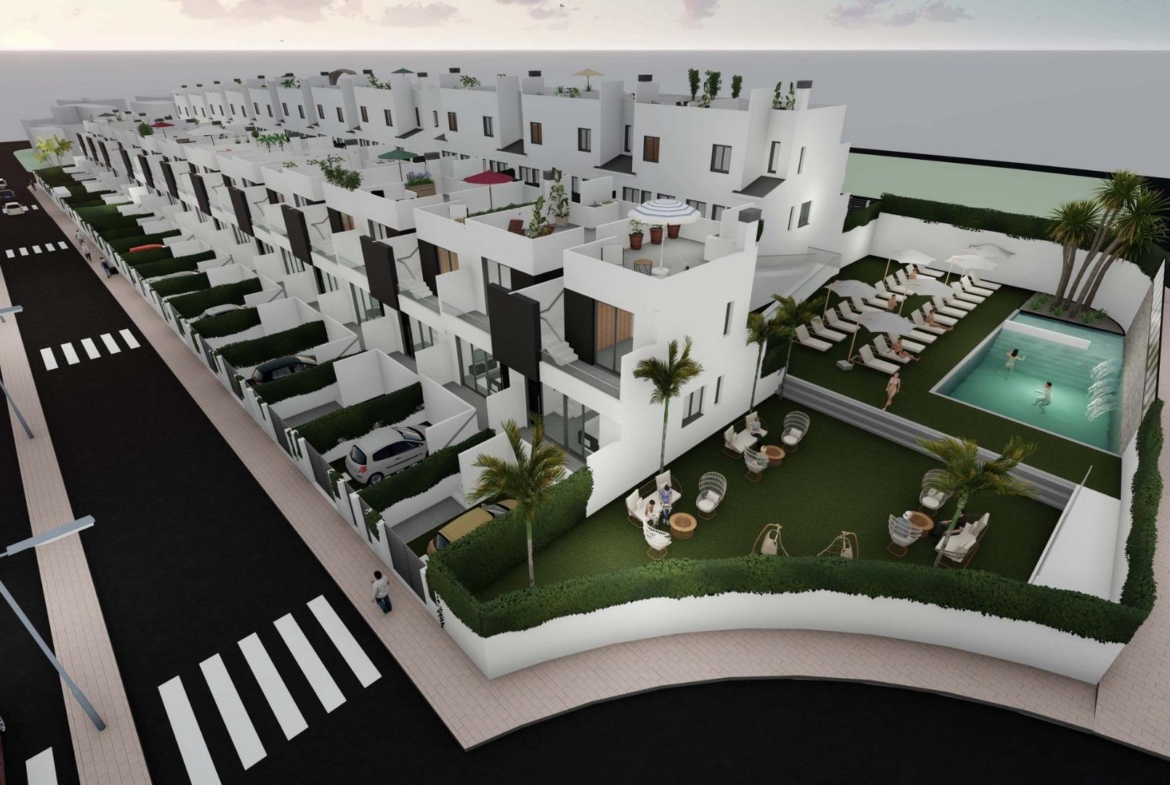 Modern sun-drenched 2 bedroom townhouse with private solarium and communal pool in landscaped Cox, Alicante neighborhood.