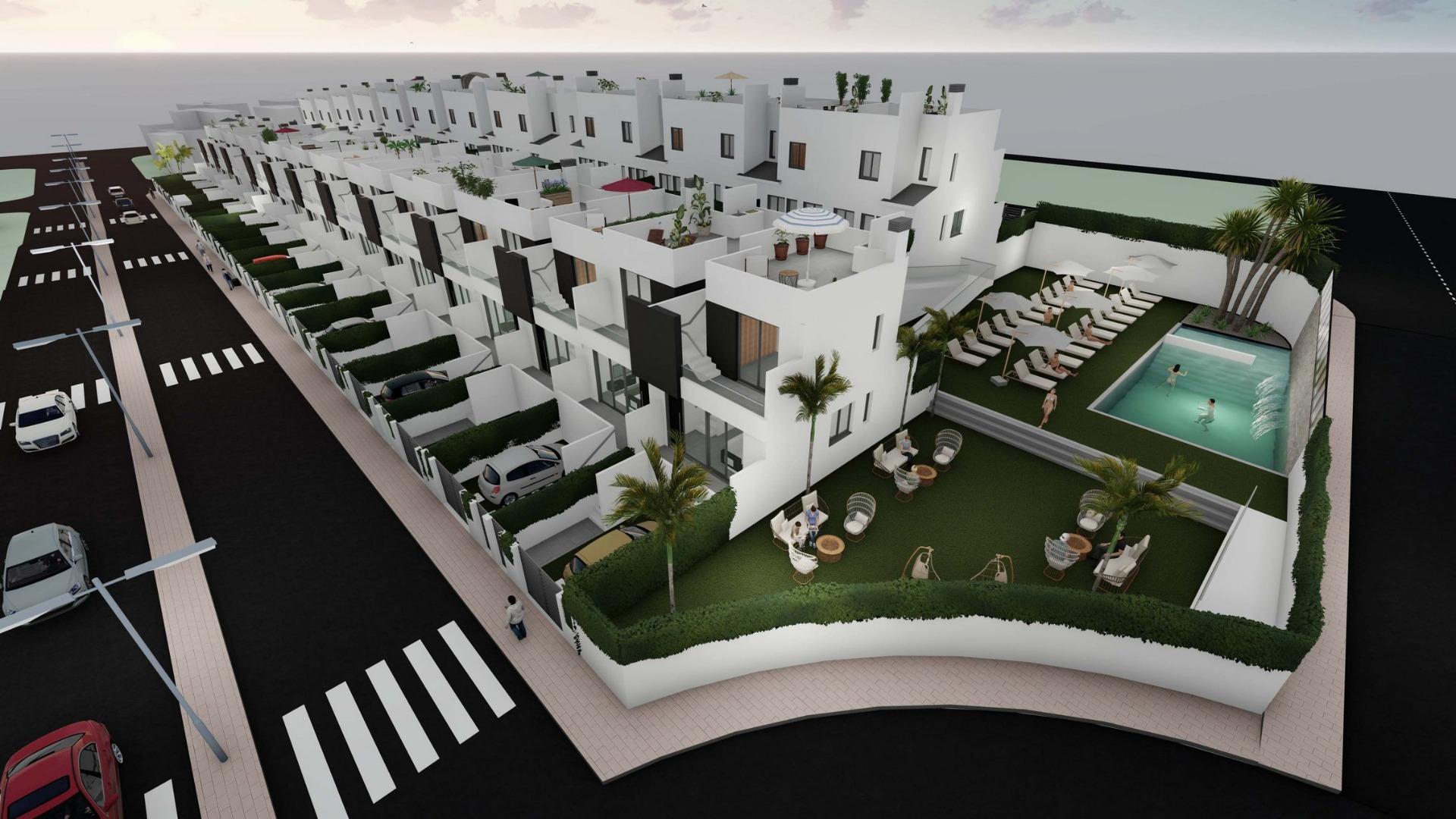 Modern sun-drenched 2 bedroom townhouse with private solarium and communal pool in landscaped Cox, Alicante neighborhood.