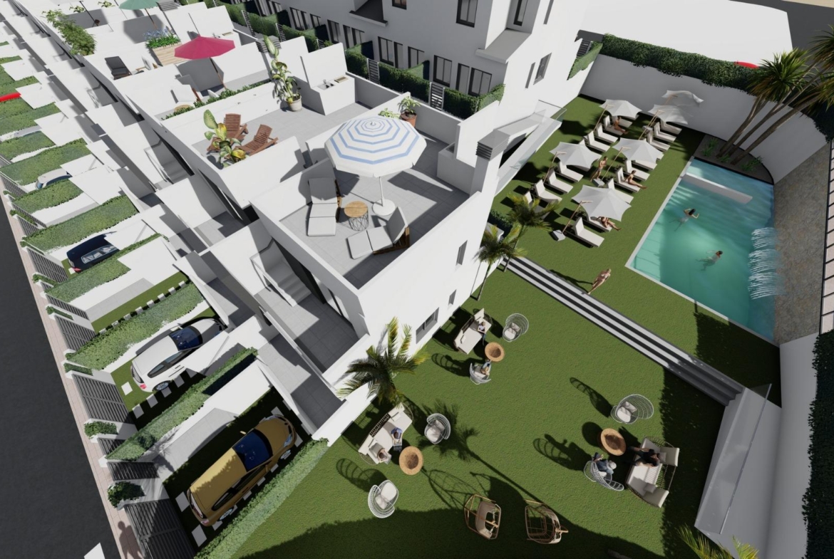 Modern affordable 2 bedroom townhouse in Cox, Alicante with sun-drenched solarium, landscaped communal garden, and refreshing pool.
