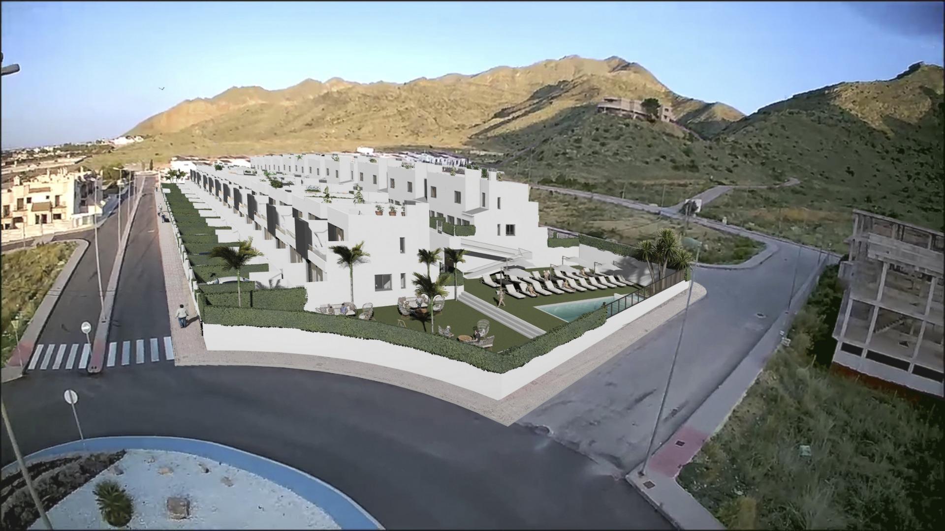 Bright modern new build 2-bedroom townhouses with landscaped gardens and communal pool, set against sunlit hills in Cox, Alicante.