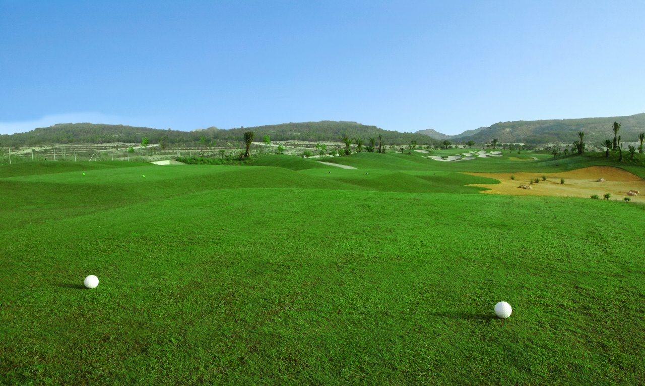New-Build-Villas-at-Vistabella-Golf-Resort-–-Orihuela-7 Lush, expansive golf course with rolling greens and distant hills in Vistabella Golf, Orihuela near luxury villa development