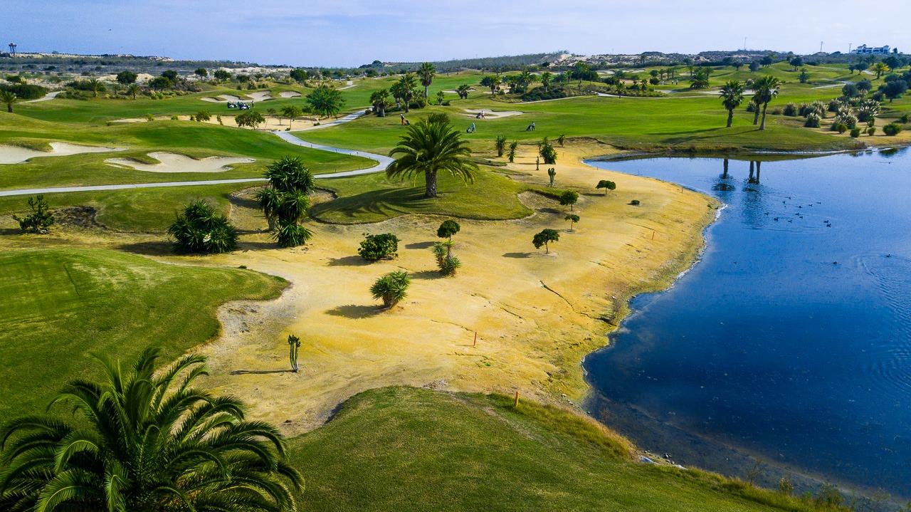 New-Build-Villas-at-Vistabella-Golf-Resort-–-Orihuela-8 Panoramic sun-drenched golf course and tranquil water view near luxury 3-bedroom villa in Vistabella Golf, Orihuela.